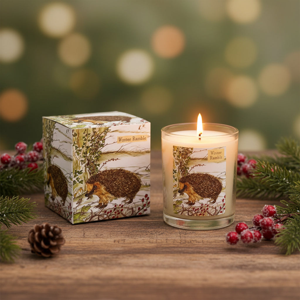 Candle with hedgehog design packaging on a white background