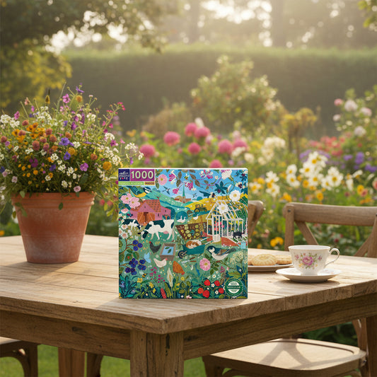Jigsaw puzzle box with a colorful design of a garden scene featuring animals and flowers, brand 'eeBoo' visible.