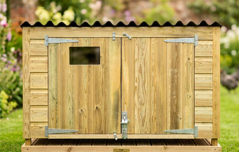 A small wooden chicken coop with double doors and a corrugated black onduline roof. Premium Materials. Pressure treated wood. Long lasting and well made. 
